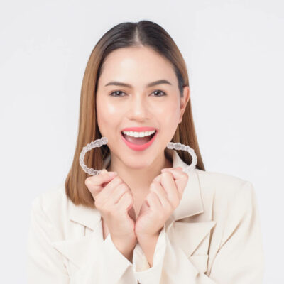 Woman with Invisalign Pros and Cons
